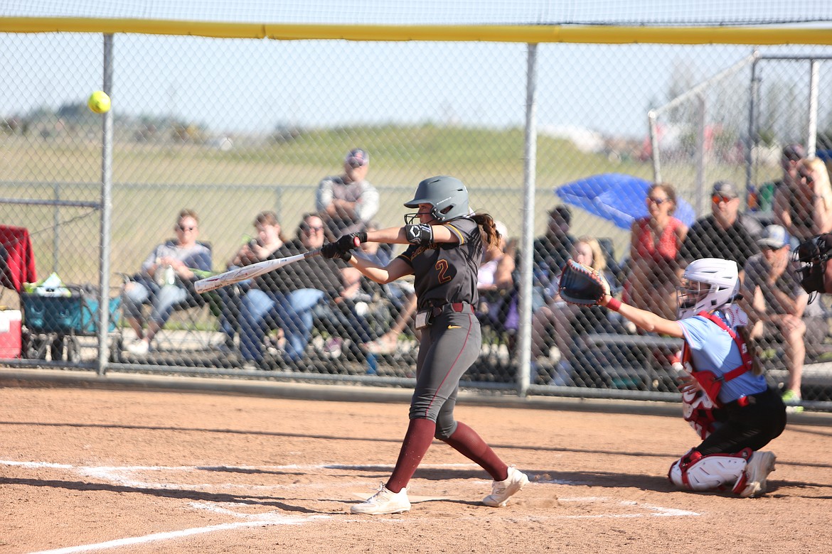 Moses Lake junior Raegen Hofheins swings at a pitch in the bottom of the seventh inning against Eastmont on Friday. Hofheins’ sac-fly scored the winning run for the Mavericks.