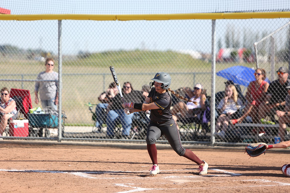 Moses Lake senior Ali Stanley starts to run to first base after making contact with a pitch.