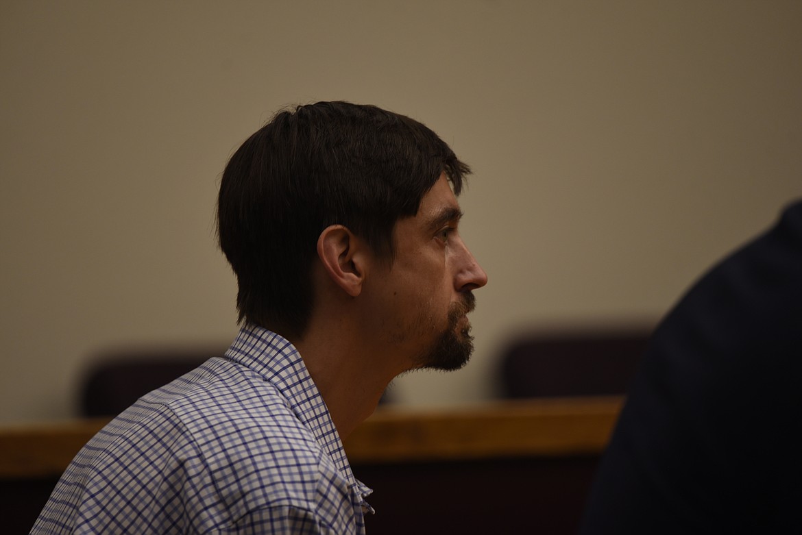 Robert Arnold Brown appears in Flathead County District Court for his arraignment on charges of intimidation and assault with bodily fluid on Monday, May 15. (Derrick Perkins/Daily Inter Lake)