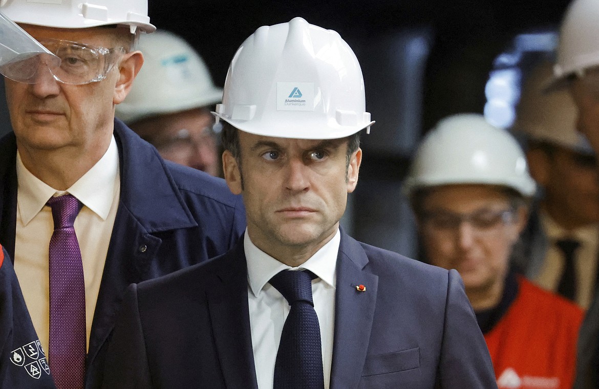 French President Emmanuel Macron visits the Aluminium Dunkerque factory in Dunkirk, northern France, Friday, May 12, 2023. Macron announced two major investments in the Dunkirk region, both in the battery sector: one worth 5.2 billion euros by Taiwan's group Prologium, the other one via a joint venture of China's XTC with French giant Orano worth 1.5 billion euros. (Pascal Rossignol/Pool Photo via AP)