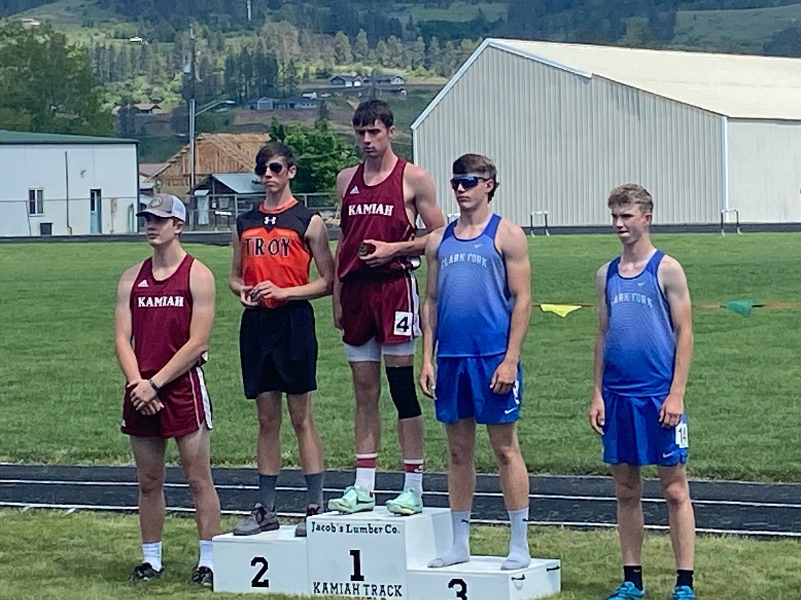 Nathan Shelton (left) and Hank Barrett (right) stand at the 110-meter hurdles podium on Saturday. Shelton placed third and Barrett placed fifth in the event.