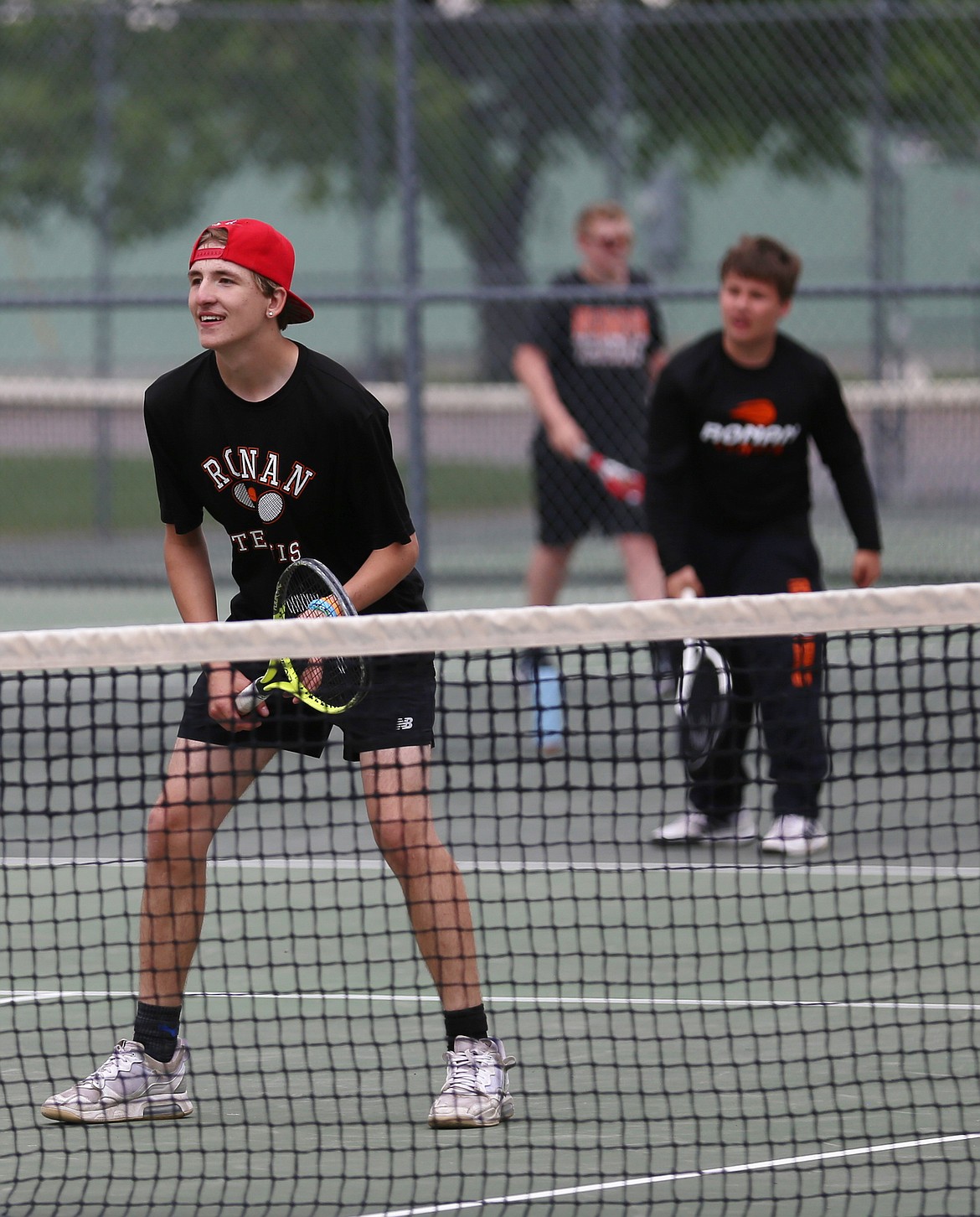Ronan senior Remi Stalheim and sophomore Tristian Buckallew (serving) partnered for doubles action against Libby last week. (Katherine Castor photo)