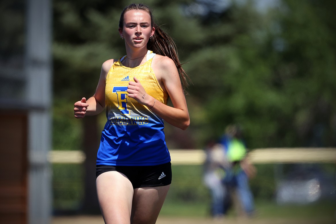 Ellie Baxter of Thompson Falls runs to a win in the 1,600-meter race at the 7B District Meet in Eureka Saturday.