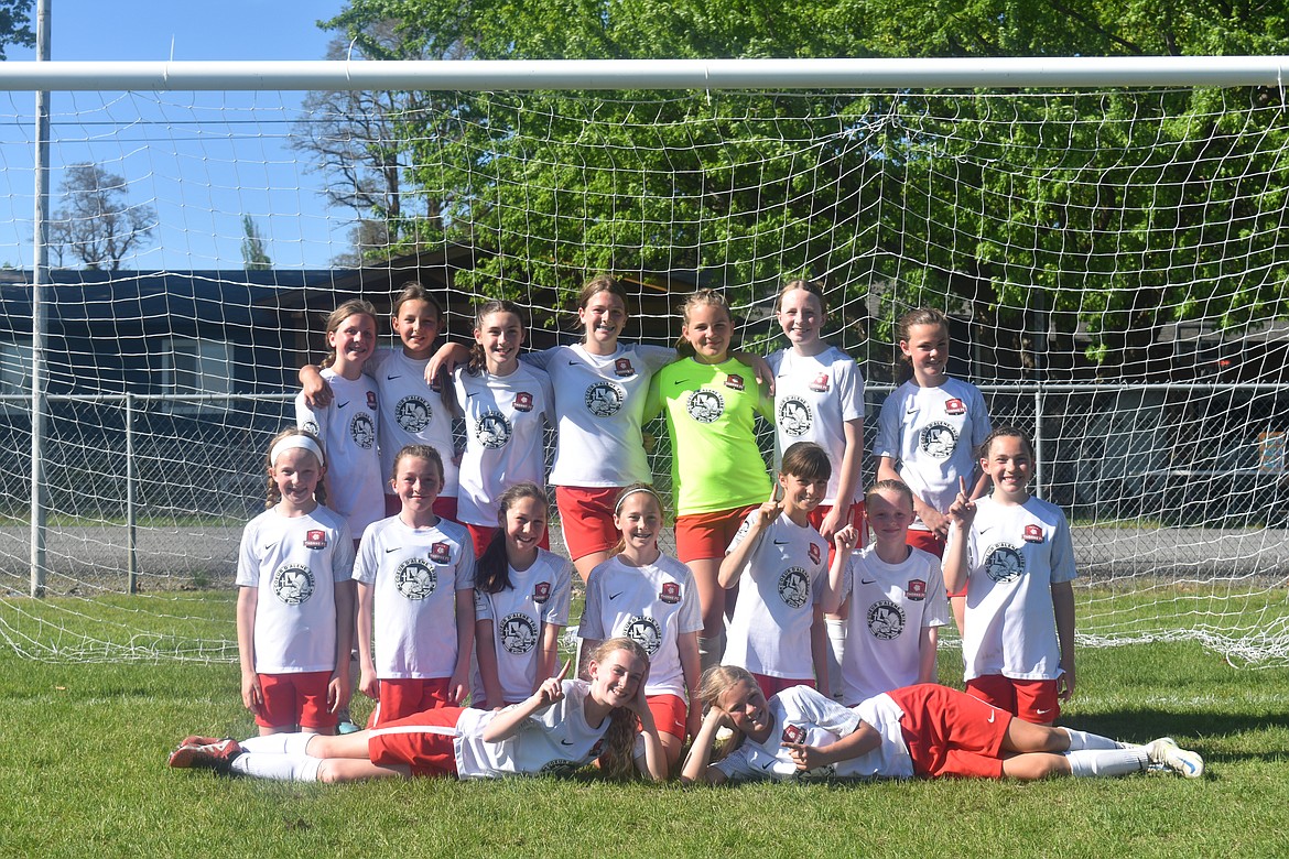 Courtesy photo
The Thorns North FC 11 Girls Academy soccer team competed last weekend in the Bill Eisenwinter Hot Shot Tournament, taking first place in the U13G Silver Bracket, outscoring their opponents 14-3. The Thorns started the tournament on Saturday with a 5-0 win over the Timbers-Thorns North FC Sandpoint Strikers FC 2010G. Presley Moreau finished the game with 2 goals, one on an assist from Payton Brennan. Teammates Brightyn Gatten, Payton Brennan and Mackenzie Dolan each scored. Dolan's goal came on an assist from Aubrey Sargent. Later that day the Thorns beat the EW Surf SC G10 Staples 4-0. Kylie Lorona started the game off with a goal coming off an assist from Presley Moreau. Brightyn Gatten quickly followed this goal with one of her own. In the second half Mackenzie Dolan scored on an assist from Kylie Lorona and Olivia Nusser finished the game with a goal scored from a free kick. Sunday morning the Thorns beat the Spokane Sounders Shadow G2010 Copa 2-1. Presley Moreau and Olivia Hynes scored the game's two goals helping the Thorns head to the championship game undefeated. The Championship game resulted in a 3-2 Thorns victory against Albion SC Idaho 2010 Academy. Constance Ovendale scored her first goal of the weekend on an assist from Presley Moreau. Presley scored her own goal a few minutes later, bringing her weekend total to 4 goals.  Kylie Lorona scored the Thorns' final goal of the tournament on an assist from Olivia Hynes. Keepers MacKenzie Dolan and Constance Ovendale held their opponents to three goals for the weekend. In the front row from left are Payton Brennan and Brightyn Gatten; middle row from left, Riley Greene, Mackenzie Dolan, Presley Moreau, Aubrey Sargent, Victoria Howard, Olivia Hynes and Ella Linder; and back row from left, Emily Hackett, Vivian Hartzell, Kylie Lorona, Olivia Nusser, Constance Ovendale, Zoey Lemmon and Ava Langer. Not pictured is coach Mark Plakorus.