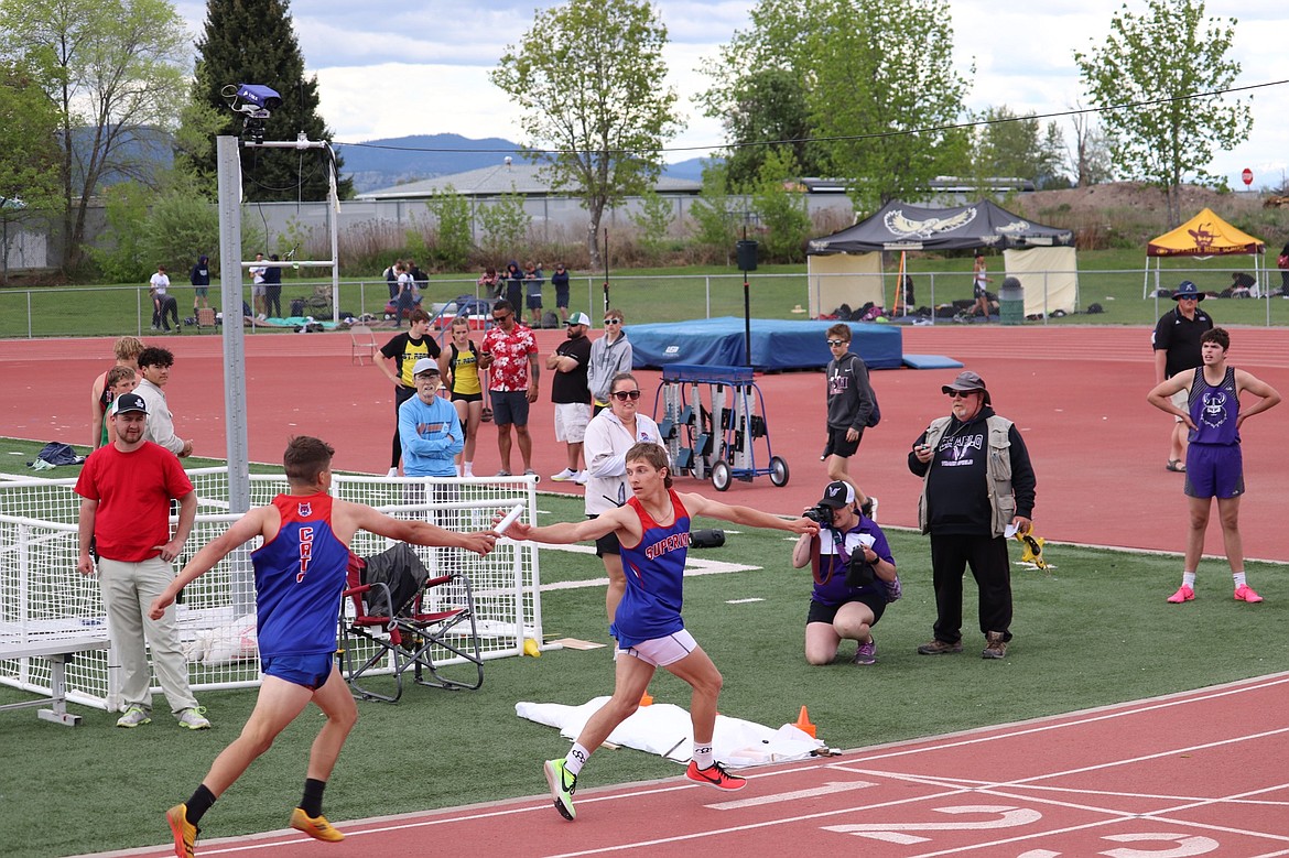 Superior eighth grader Turner Milendere (left) hands off to his brother Decker during the Bobcats winning 14C 4X100 relay race Saturday in Missoula.  (Kami Milender photo)