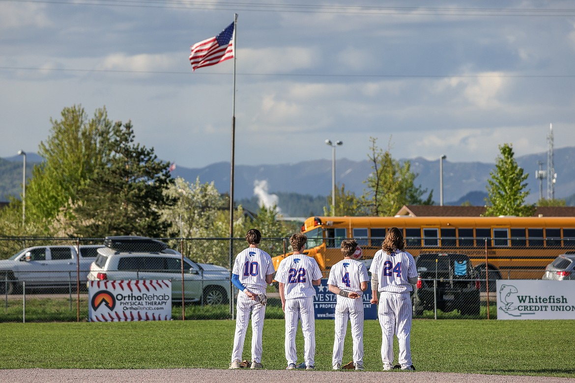 Dayne Tu, Reggie Sapa, Dominick Younf and Cody Schweikert during the pledge of allegiance last week against Whitefish. (JP Edge photo)