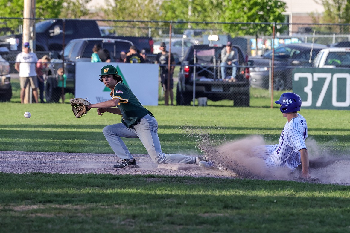 Reggie Sapa safely slides into second by a hair. (JP Edge photo)