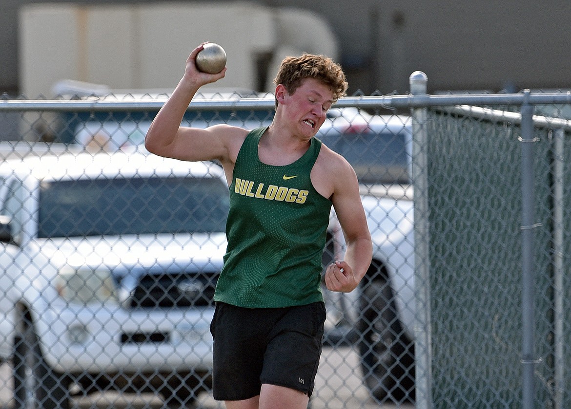 Bulldog Creed Scott competes in shot put at the Whitefish Triangular track meet on Thursday. (Whitney England/Whitefish Pilot)