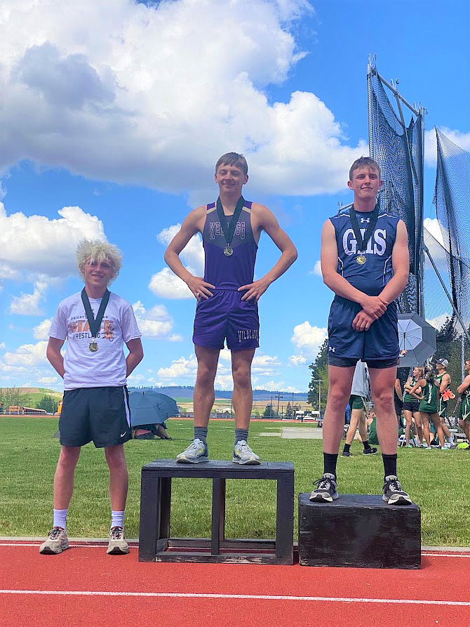 Brayden Lamanna (left) places third in the 3200-meter run at 2A districts with a time 10:30.01