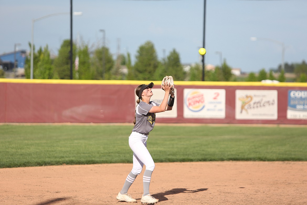 Royal junior Raegen Wardenaar catches a pop-up in the infield against Moses Lake on Monday.