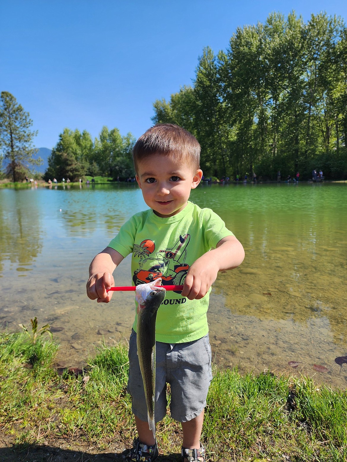 During last Saturday's Rotary Club of the Kootenai Valley Lil Anglers day at the Mill Pond, 2-year-old Libby resident Brookston Timbrook, reeled in this beautiful 11-inch trout. (Photo courtesy Dee Teske)