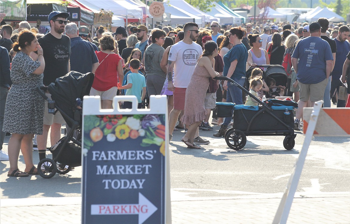 A crowd lines Main Street at Riverstone for the opening day of the Kootenai County Farmers' Market on Wednesday at Riverstone.