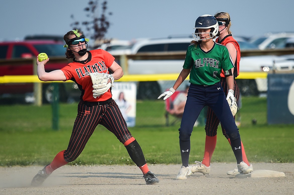 Flathead shortstop Kaidyn Lake (10) throws across the diamond for an out on a ground ball in the fifth inning against Glacier at Glacier High School on Thursday, May 18. (Casey Kreider/Daily Inter Lake)