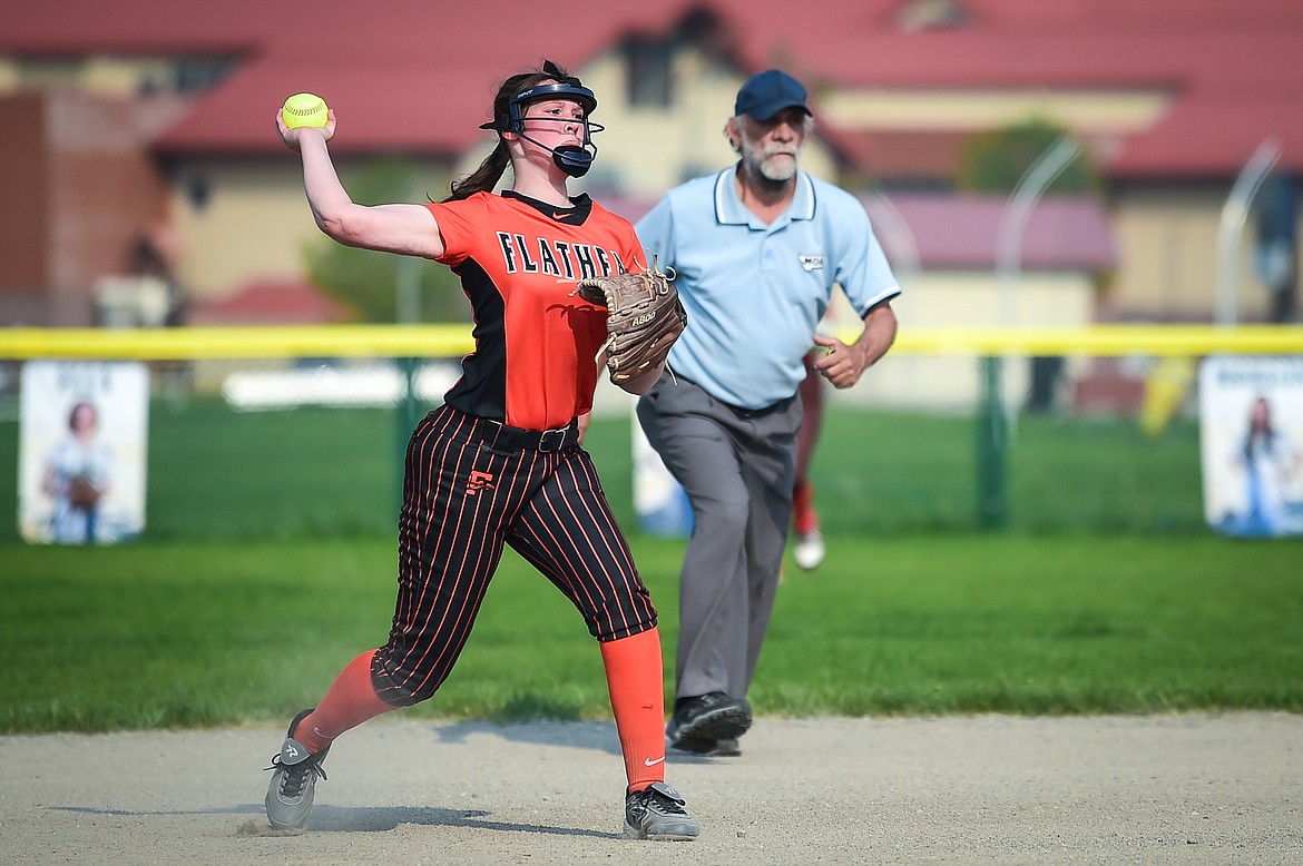 Flathead third baseman Ellie Eve (9) throws to first in time to nab Glacier's Ella Farrell in the fourth inning at Glacier High School on Thursday, May 18. (Casey Kreider/Daily Inter Lake)