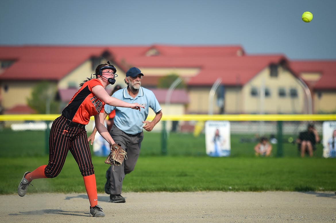 Flathead third baseman Ellie Eve (9) throws to first in time to nab Glacier's Ella Farrell in the fourth inning at Glacier High School on Thursday, May 18. (Casey Kreider/Daily Inter Lake)