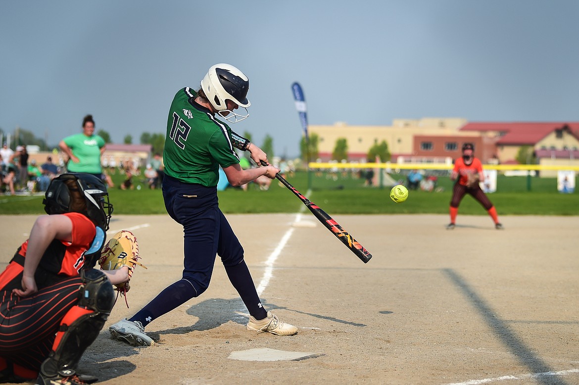 Glacier's Ella Farrell (12) connects on a single against Flathead at Glacier High School on Thursday, May 18. (Casey Kreider/Daily Inter Lake)