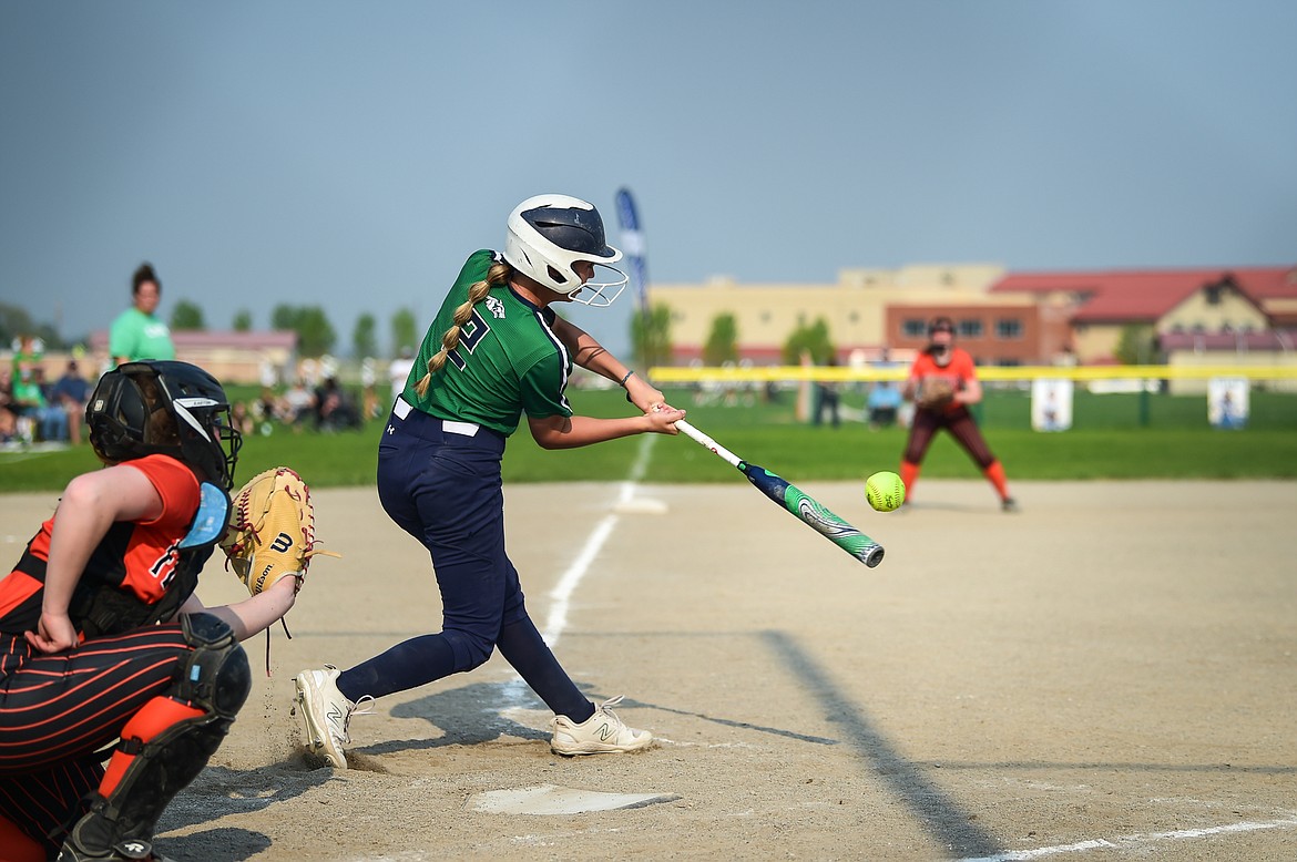 Glacier's Kenadie Goudette (2) connects on a two-run home run in the fourth inning against Flathead at Glacier High School on Thursday, May 18. (Casey Kreider/Daily Inter Lake)