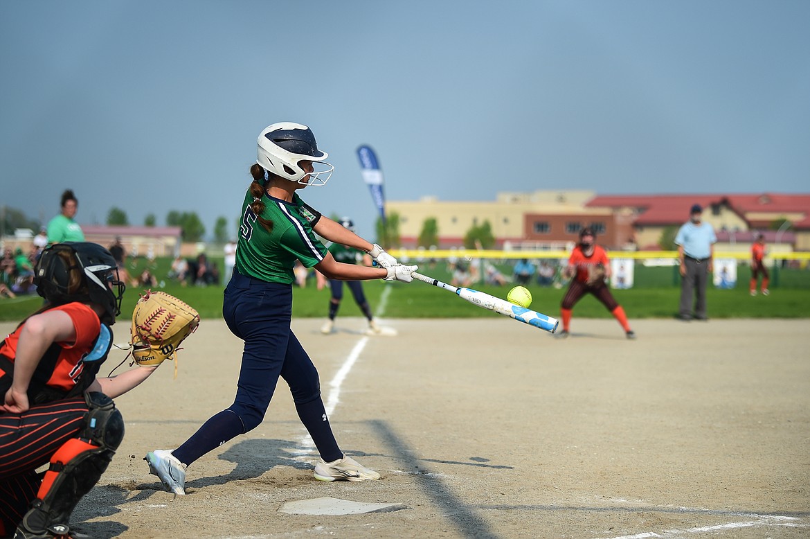 Glacier's Zoey Allen (5) connects on a two-run home run in the third inning against Flathead at Glacier High School on Thursday, May 18. (Casey Kreider/Daily Inter Lake)