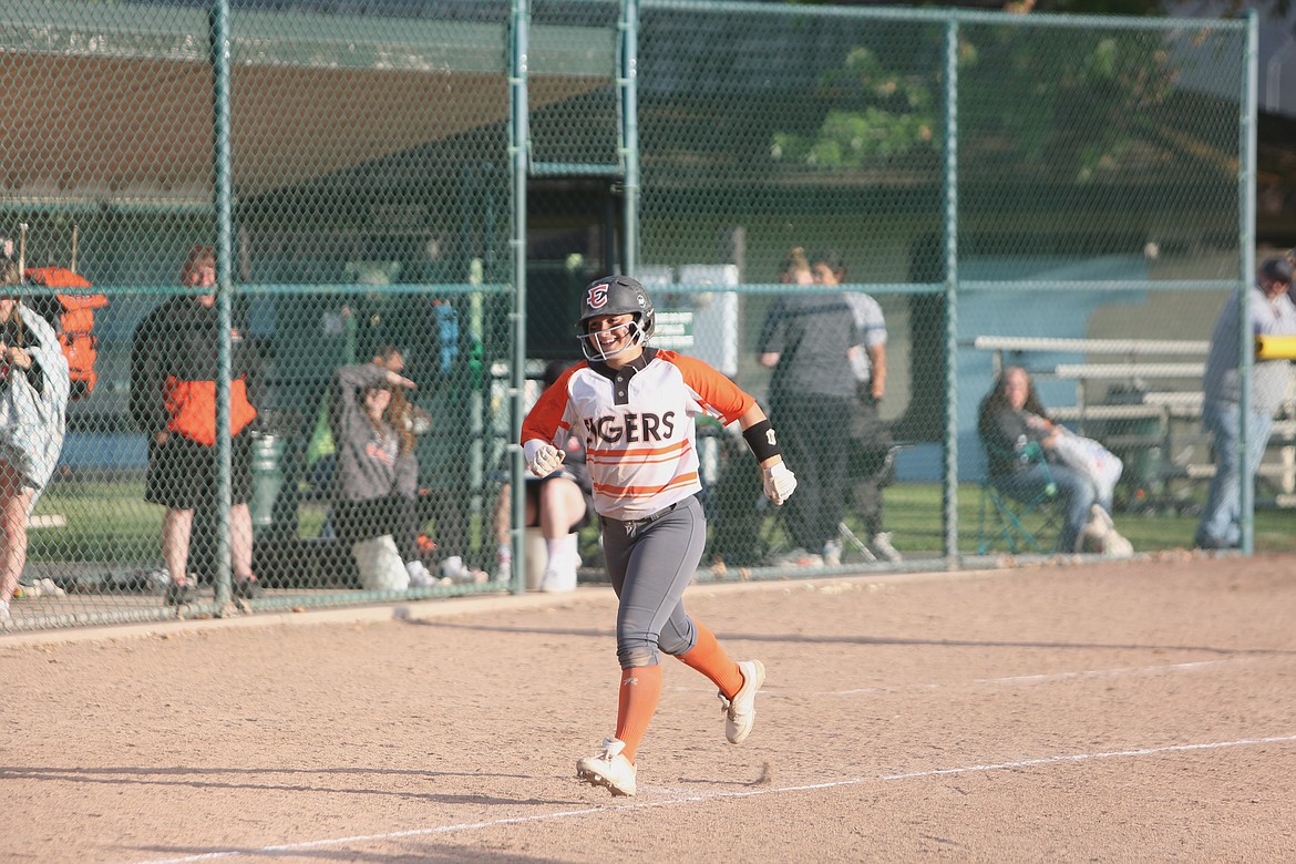 Ephrata sophomore KK Hector smiles as she runs to home plate after hitting a home run in the top of the seventh inning against East Valley (Yakima) on Tuesday.