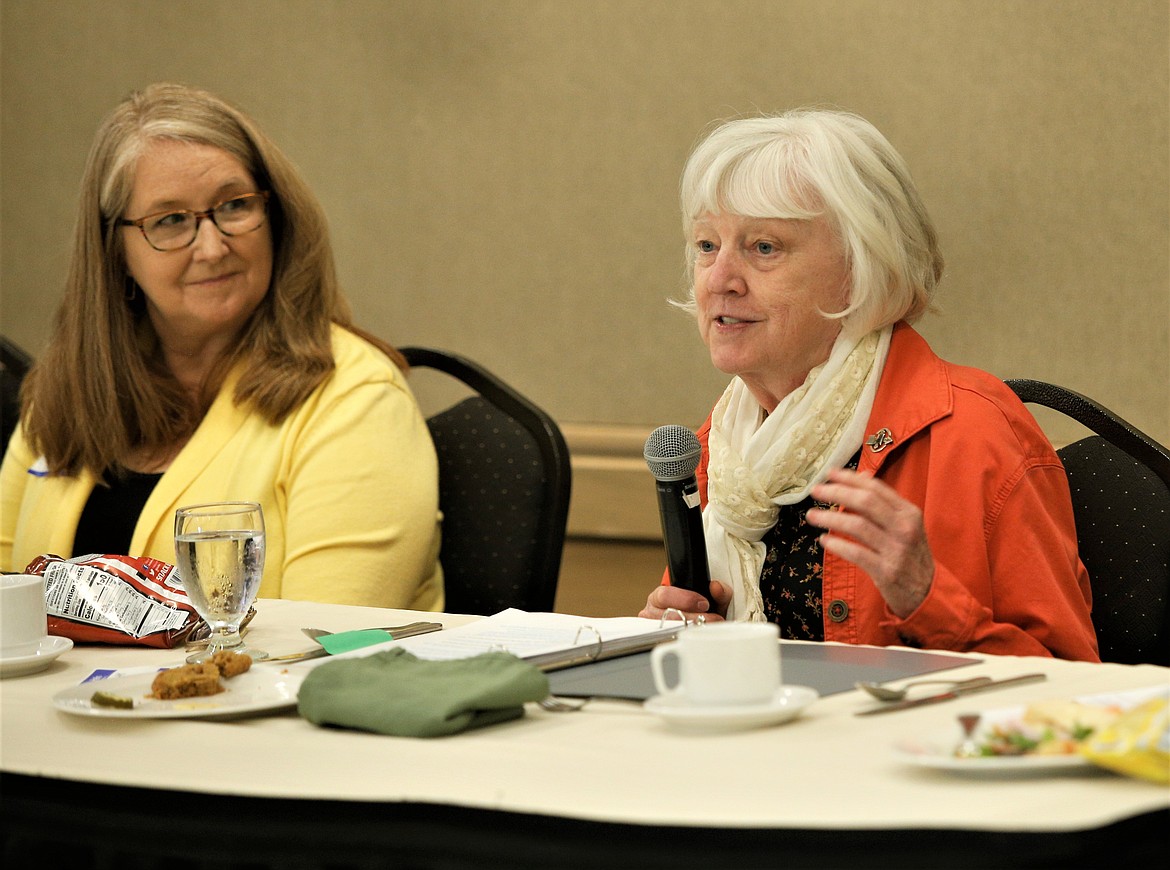 Dr. Kathy Canfield Davis, right, speaks while Dr. Kristine Hoover looks on during the Kootenai County Task Force on Human Relations' luncheon at the Best Western Plus Coeur d'Alene Inn on Thursday.