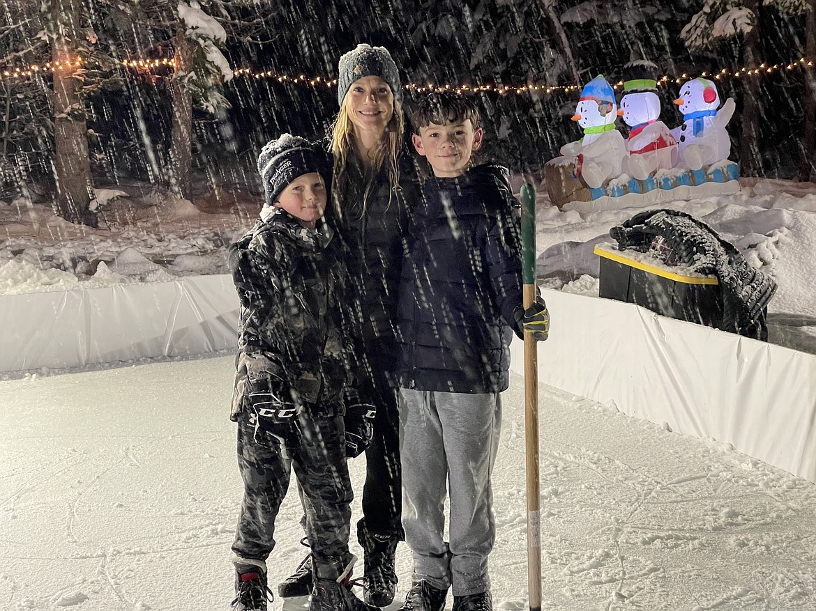 Hockey players Gio Balsimo, Andrea Balsimo and Micco Balsimo skate on a rink they made in their Athol backyard last winter. Andrea is advocating for another local ice rink so her kids can get more skate time year-round and parents throughout the Panhandle have access to hockey or figure skating.