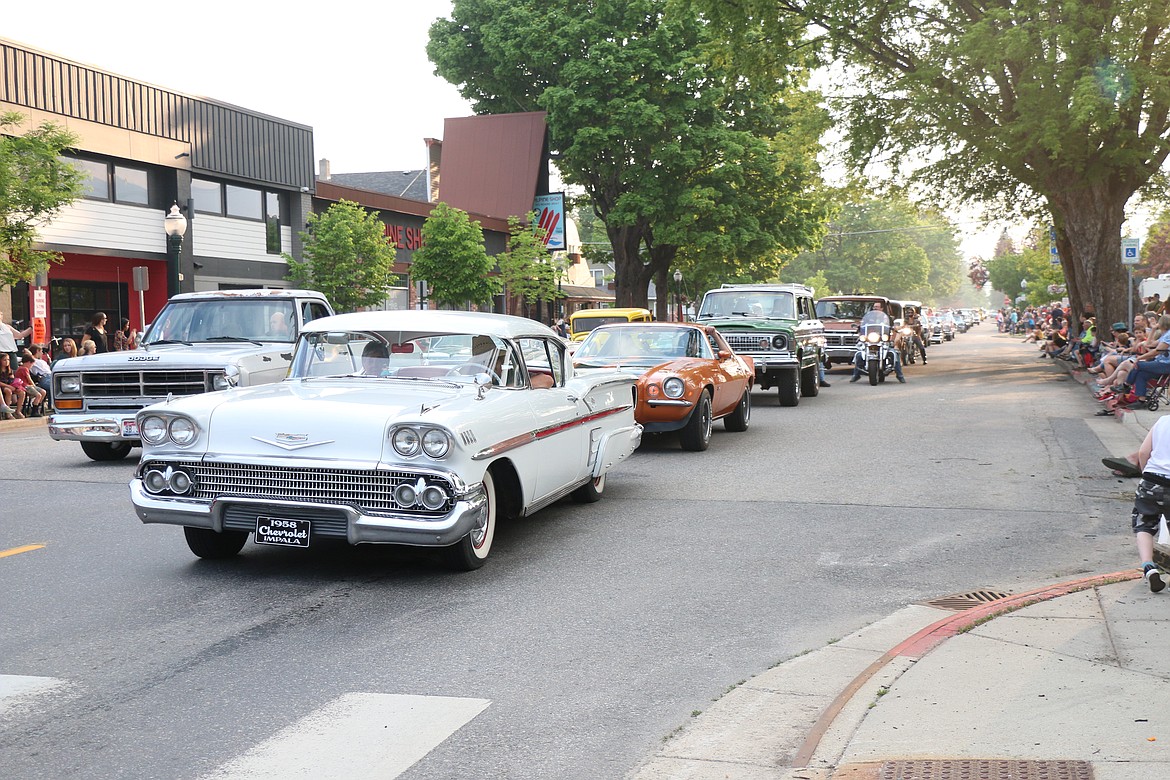 Classic cars make their way down Church Street during the Lost in the '50s parade on Friday night.