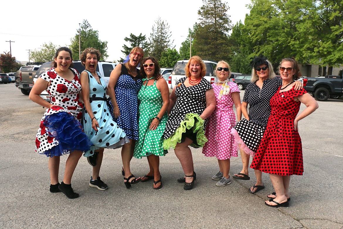 Members of the Polka Dot Posse pose for a group photo as they get ready for the Lost in the '50s parade on Friday night.