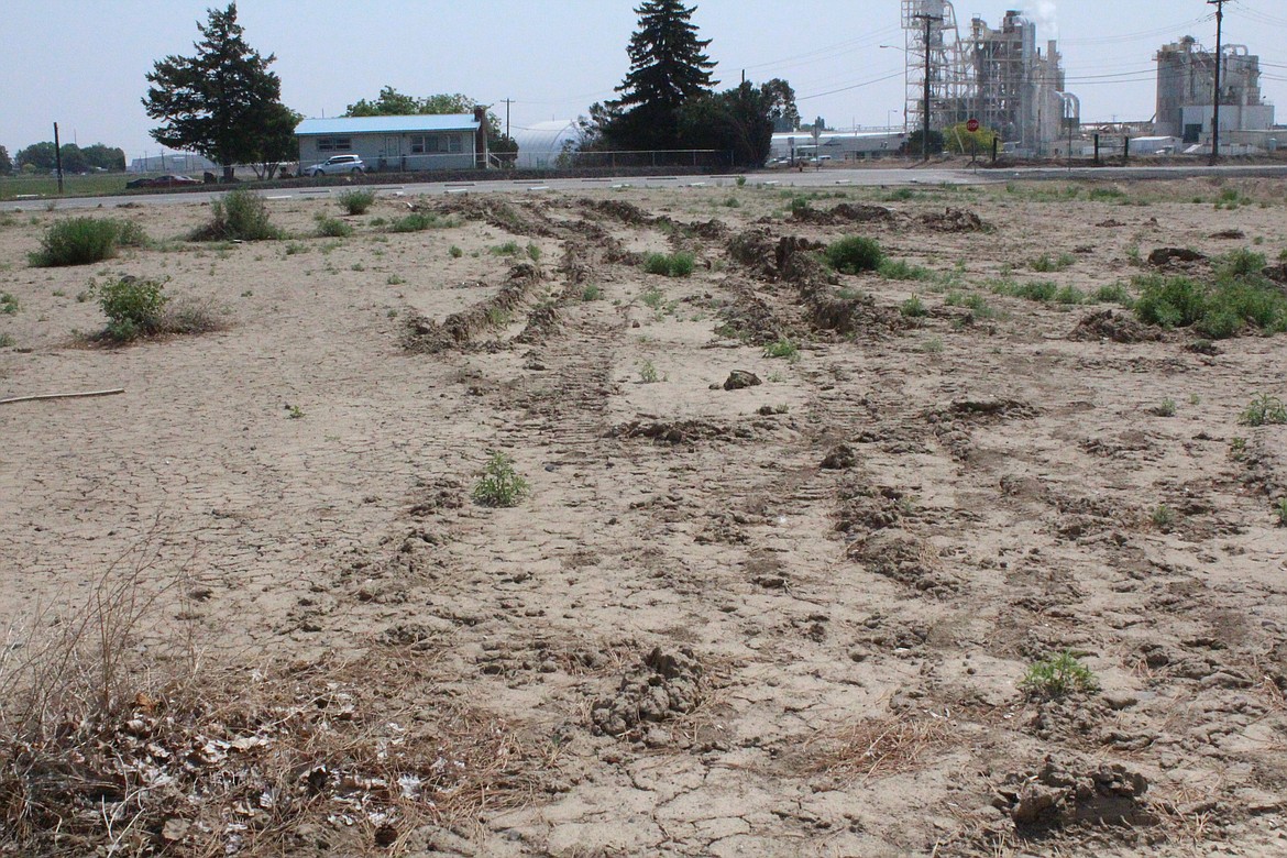 A vacant lot at the intersection of Sixth Avenue NE and E Street Northeast in Quincy, pictured, is slated for development as a park in 2024.