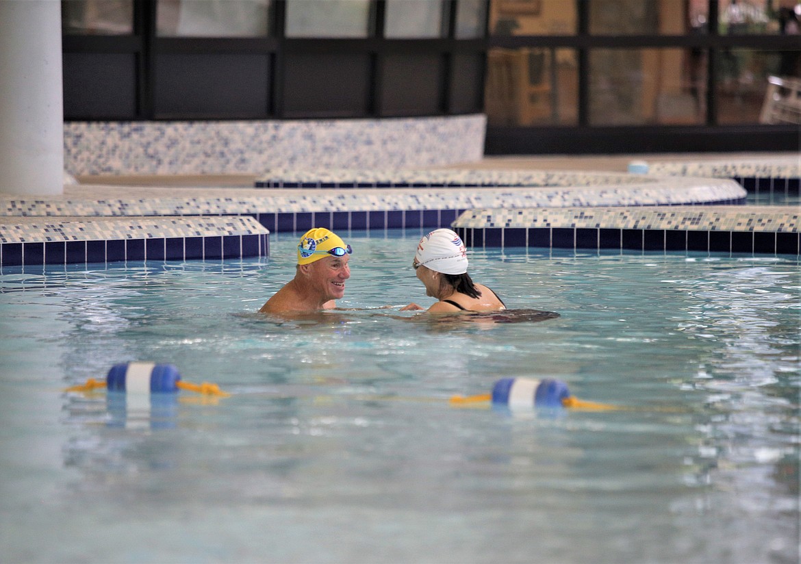 Swim instructor Kerry O’Brien talks to student Barbara Piephoff during lessons at the Kroc Center.