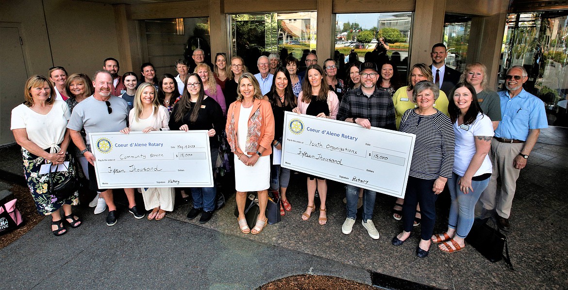 Coeur d’Alene Rotary Club members join grant recipients outside The Coeur d'Alene Resort on Friday. The Coeur d’Alene Rotary Club and The Coeur d’Alene Rotary Foundation presented $30,000 in grants to 21 organizations.