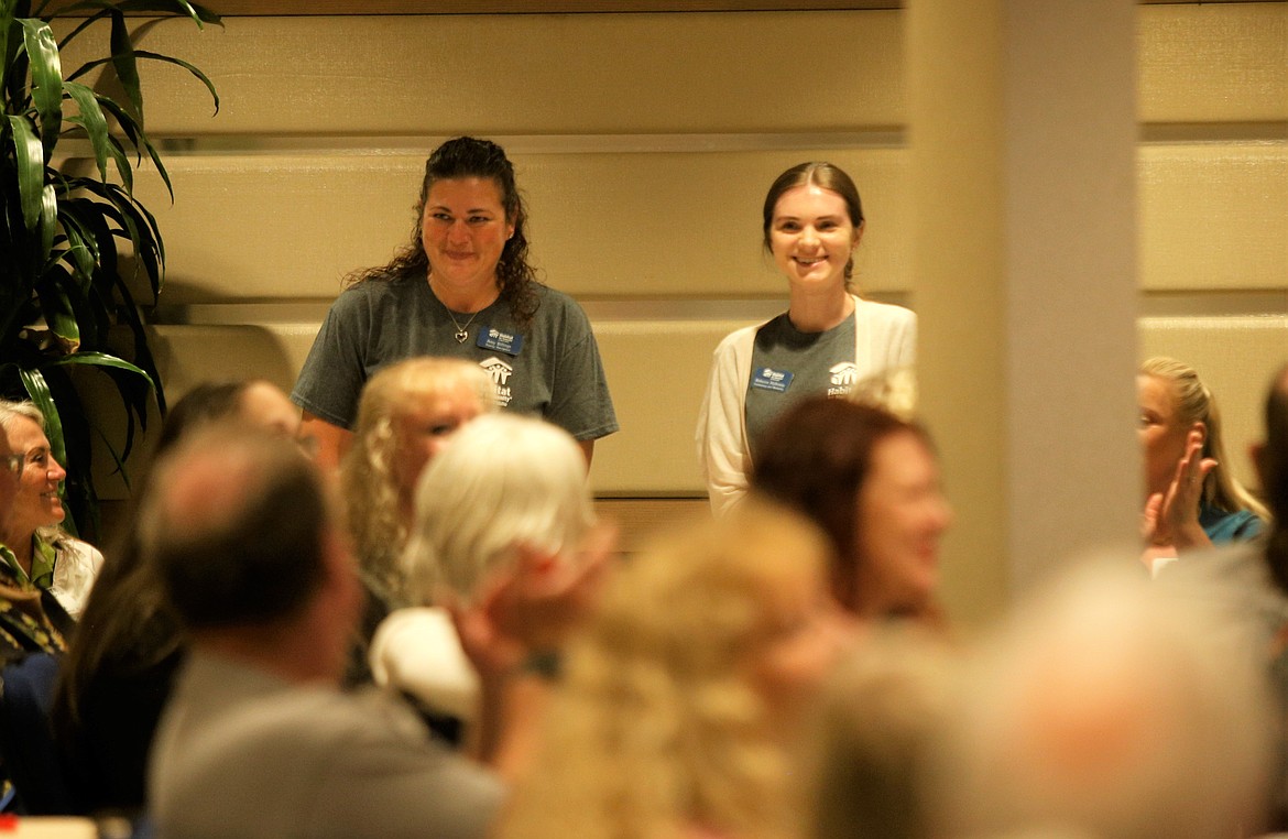 Amy Billings, left, and Rebecca Hollway with Habitat for Humanity of North Idaho stand after receiving a $1,000 grant from The Coeur d’Alene Rotary Club and The Coeur d’Alene Rotary Foundation at The Coeur d'Alene Resort on Friday.