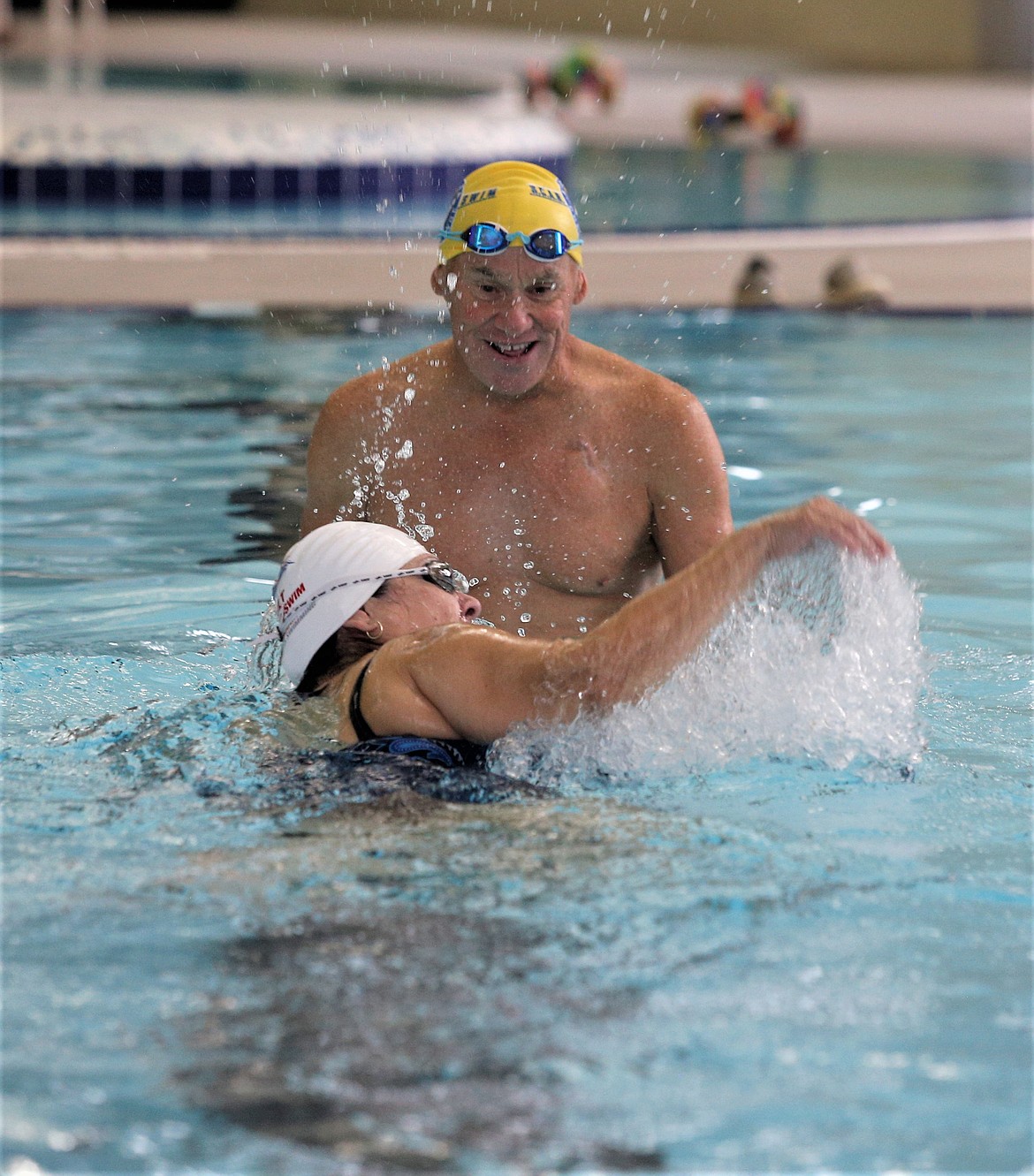 Instructor Kerry O’Brien watches Barbara Piephoff swim during lessons at the Kroc Center on Wednesday.