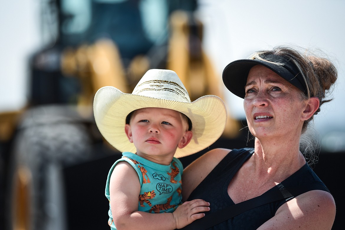 Pauline Bekesza and her grandson Boaz watch the heavy equipment in operation at the DIG Rotary event held by Kalispell Rotary Daybreak and Noon clubs at Rose Crossing and Highway 93 on Saturday, May 20. Attendees got the opportunity to operate excavators, bulldozers and graders at the Dig Rotary event held by  Kalispell Rotary Daybreak and Noon clubs at Rose Crossing and Highway 93 on Saturday, May 20. (Casey Kreider/Daily Inter Lake)