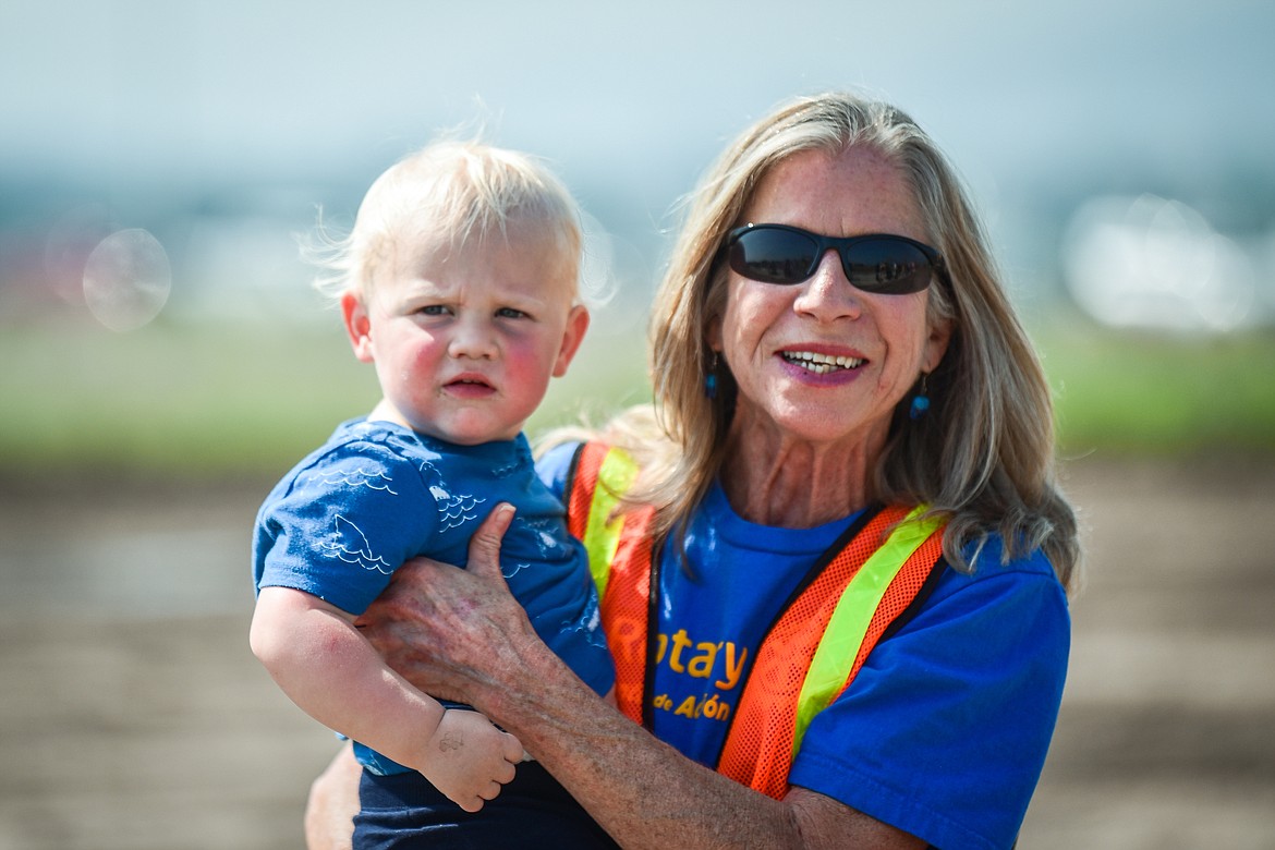 Volunteer Lucy Smith gives Jay Upham a lift after a ride in a piece of heavy construction equipment at the DIG Rotary event held by Kalispell Rotary Daybreak and Noon clubs at Rose Crossing and Highway 93 on Saturday, May 20. Attendees got the opportunity to operate excavators, bulldozers and graders at the Dig Rotary event held by  Kalispell Rotary Daybreak and Noon clubs at Rose Crossing and Highway 93 on Saturday, May 20. (Casey Kreider/Daily Inter Lake)