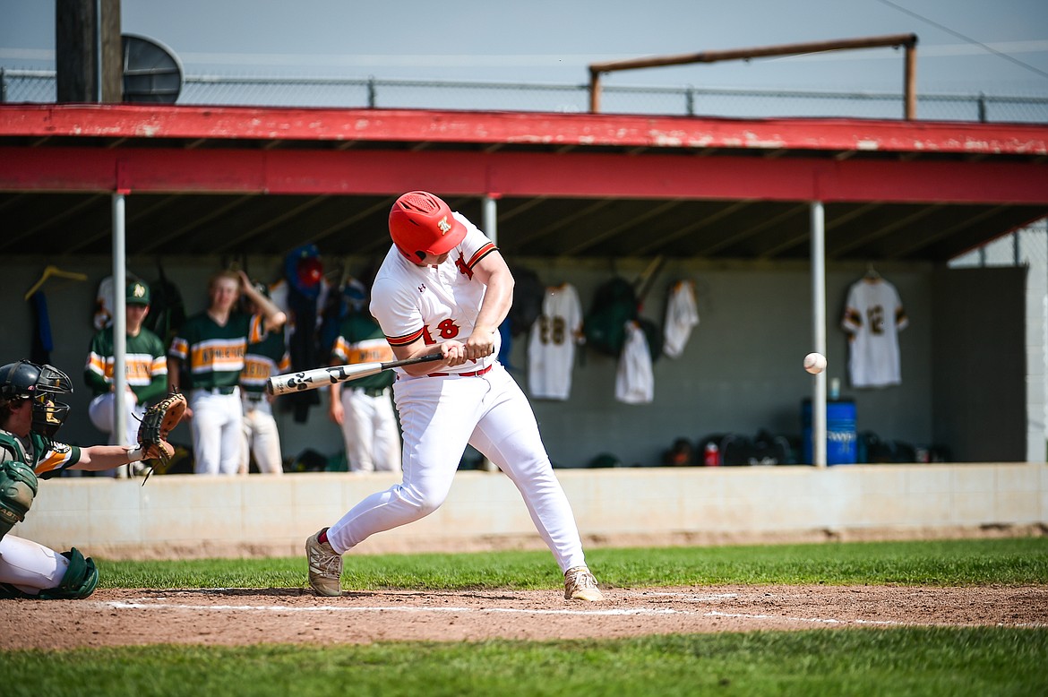 Kalispell Lakers AA's Kane Morisaki (18) connects on an RBI double in the first inning against the Sherwood Park AAA Athletics in the Canadian Days Tournament at Griffin Field on Saturday, May 20. (Casey Kreider/Daily Inter Lake)