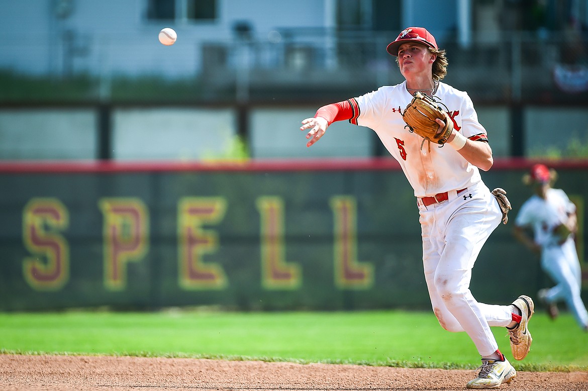 Kalispell Lakers AA second baseman Carter Schlegel (5) throws to first after fielding a grounder against the Sherwood Park AAA Athletics in the Canadian Days Tournament at Griffin Field on Saturday, May 20. (Casey Kreider/Daily Inter Lake)