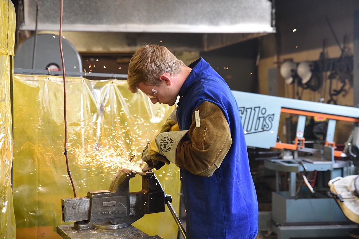 Libby High School student Greysen Thompson performs a weld during certification testing in May. (Scott Shindledecker/The Western News)