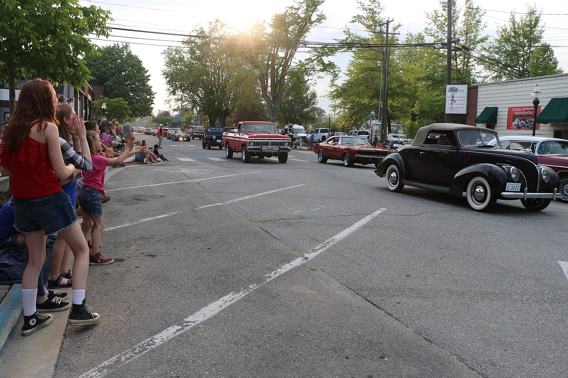 Lost in the '50s car parade participants make their way down Church Street during the classic car parade on Friday night.