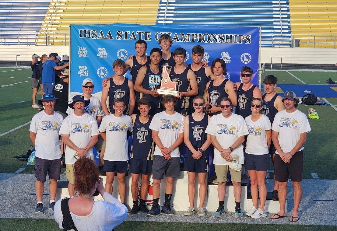 Courtesy photo
Members of the Timberlake High track and field team, as well as their coaches, accept the second-place trophy at the state 3A meet on Saturday at Middleton High. In the front row, from left are head coach Brian Kluss, assistant coach Kelly Amos, Caius Tebbe, Austin Wilson, Tyler Wendt, Josh Yeager, assistant coach Rob Ranney, assistant coach Molly Miller and assistant coach Shawn Lawler. In the middle are assistant coach Tony Kraack, Jacob Yetter, Alex Marquez, Vaughn Higgins, Wyatt MacArthur, Hunter Higgins, Nolan Marosi and Jacob Vallieres. In the top are Karson Vordahl and Jacob Barnhart.