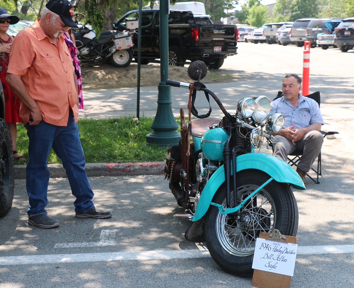 Bill Felton sits by his classic motorcycles during the annual Lost in the '50s car show.