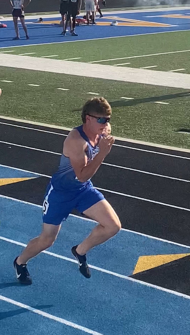 Nathan Shelton competes in the 300-meter hurdles on Friday. Shelton qualified for the finals on Saturday and placed sixth.