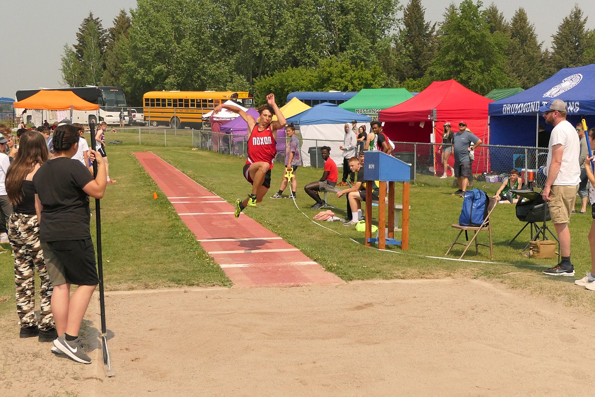 Noxon sophomore Ricky Williams goes airborne during the triple jump competition at this past weekends Class C Divisional track and field meet in Missoula. (Chuck Bandel/VP-MI)