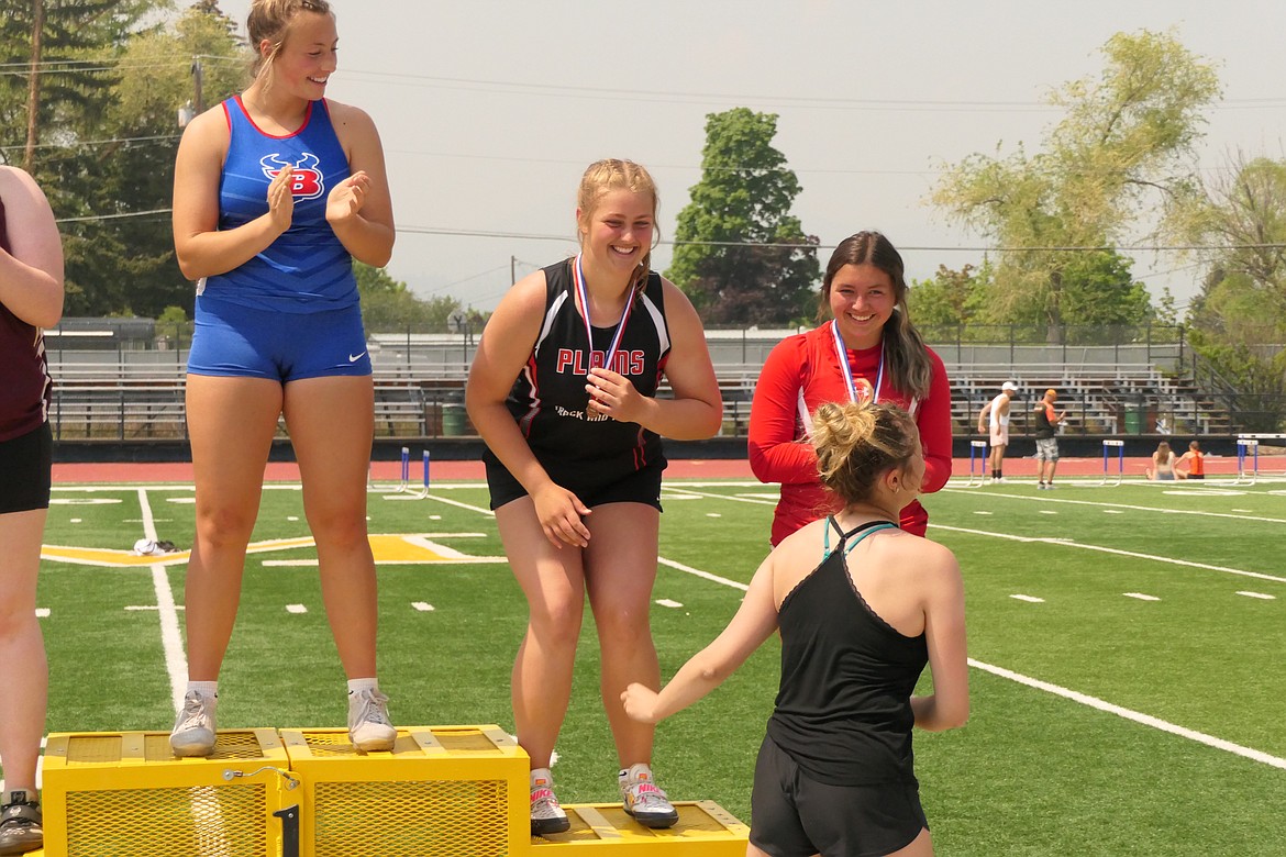 Plains sophomore Alexis Deming on the medal stand after placing third in the shot put event during this past weekend's Western Divisional track meet in Missoula. (Chuck Bandel/VP-MI)