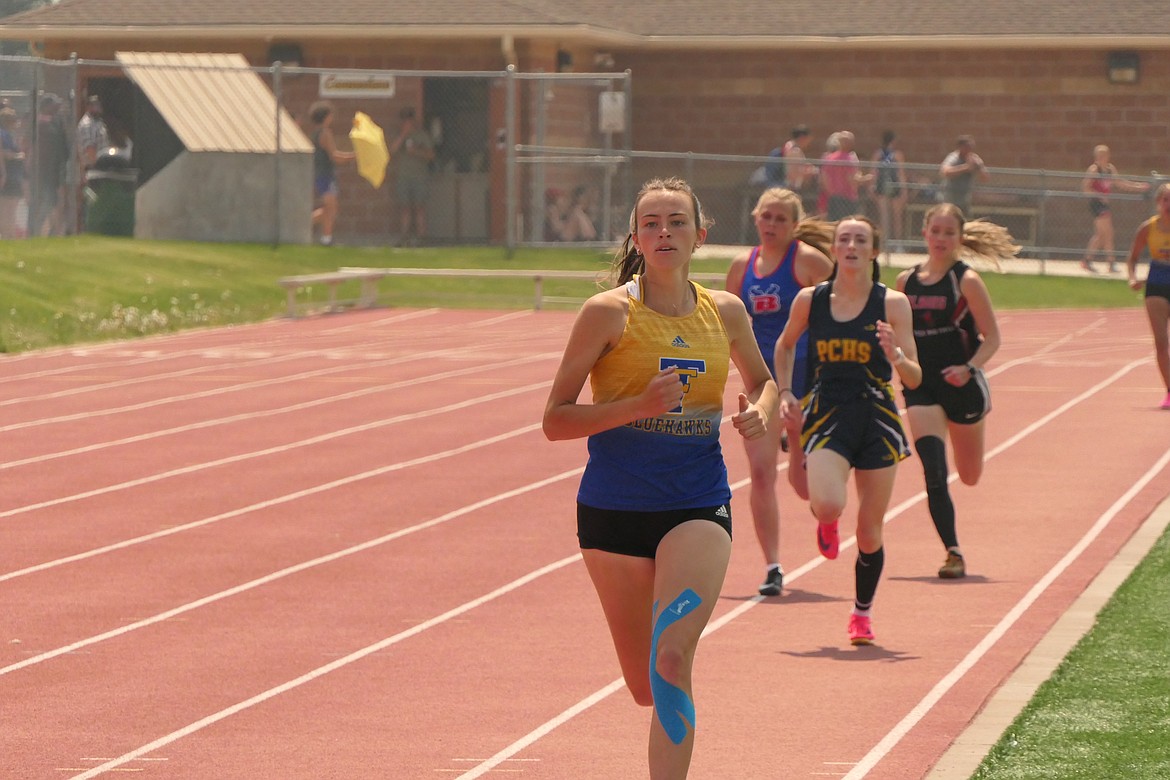 Thompson Falls senior Ellie Baxter leads the 800 meter run field on her way to a first-place finish at the Western Divisional meet this past weekend in Missoula. (Chuck Bandel/VP-MI)