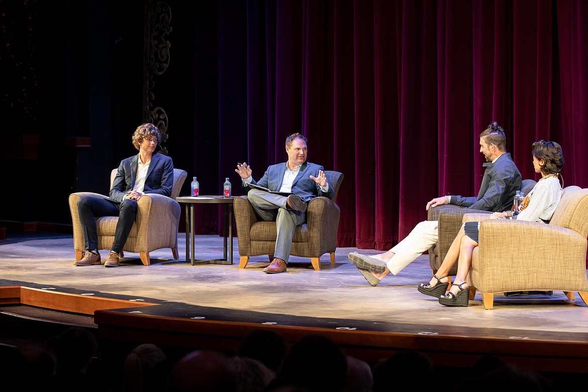 Coeur d'Alene High School senior Alexander Nipp, left, and Jimmy McAndrew are joined Monday on stage by gold medal-winning Olympic swimmer Michael Phelps and wife Nicole Phelps at the Kroc Center.