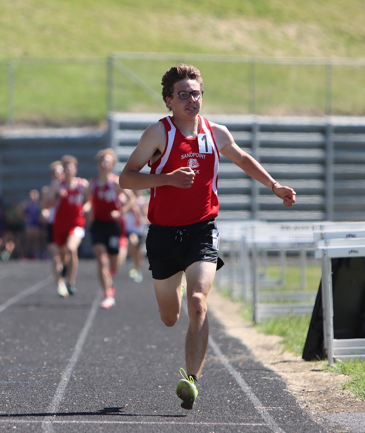 Nathan Roche crosses the line in first in the 1600-meter run at the 4A regional championship earlier this season