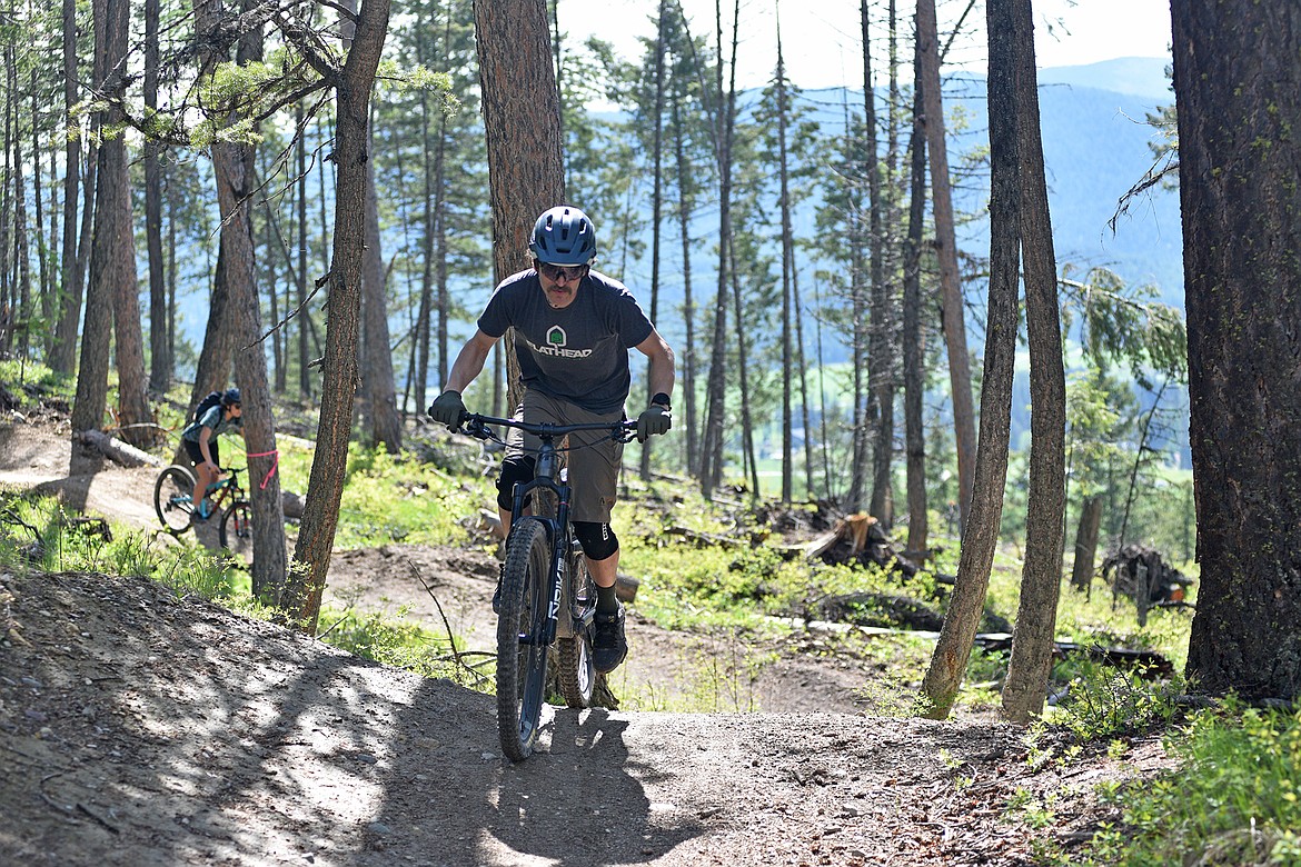 Ron Brandt, Executive Director of FAMB rides a two-wheeled bike down Otter Pop recently. (Julie Engler/Whitefish Pilot)