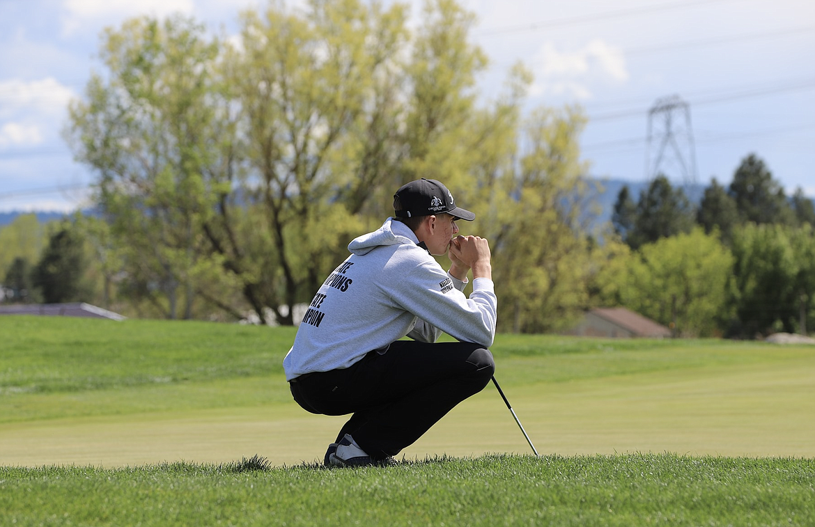 Courtesy photo
Kellogg High junior Stephen Paul lines up a putt during the 2A District 1-2 tournament at The Links in Post Falls. Paul shot an 8-under-par 65 to win the individual championship by a single stroke.