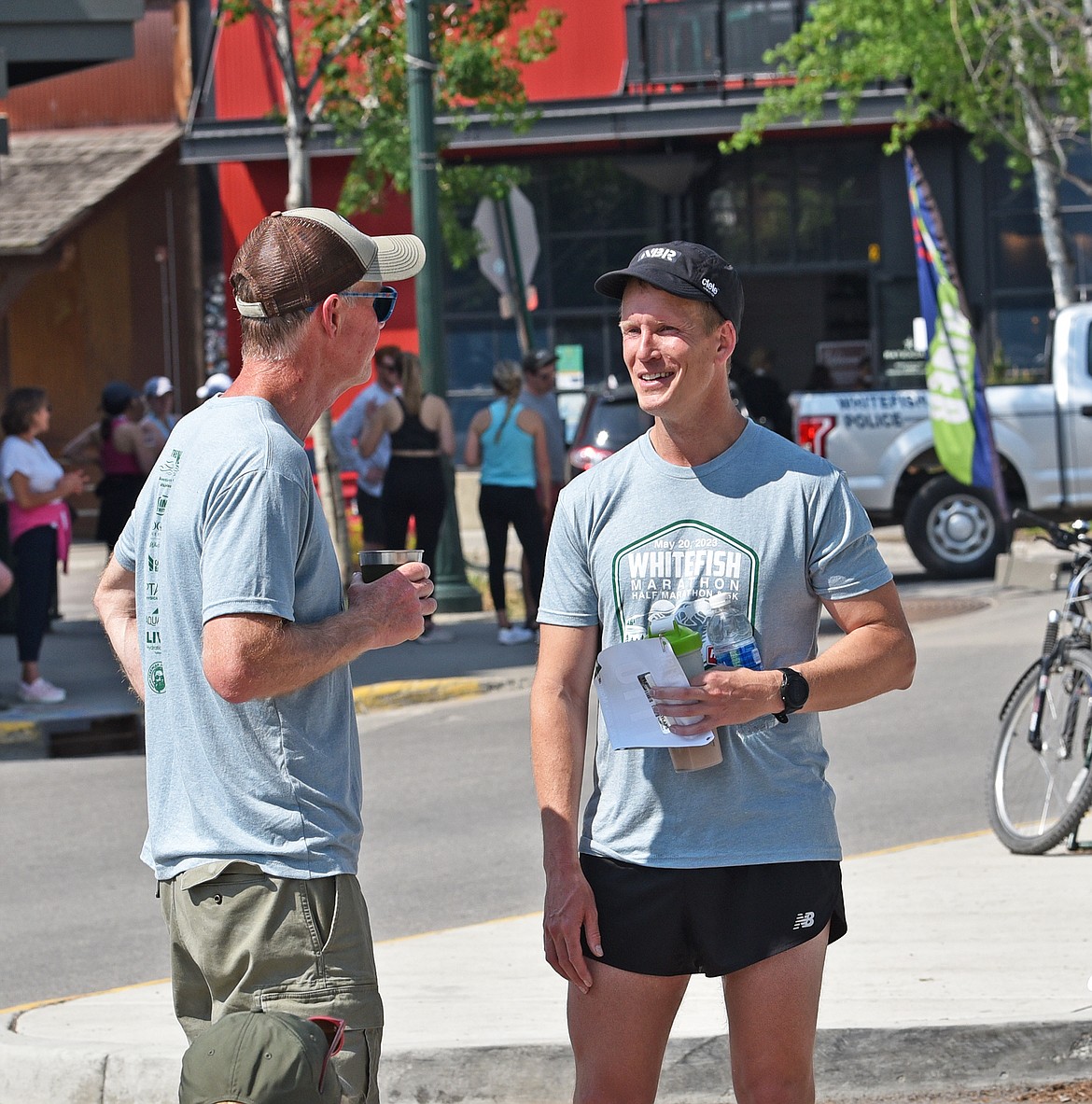 Michael Ortley, winner of the Whitefish Marathon, chats with a friend after the race. (Julie Engler/Whitefish Pilot)