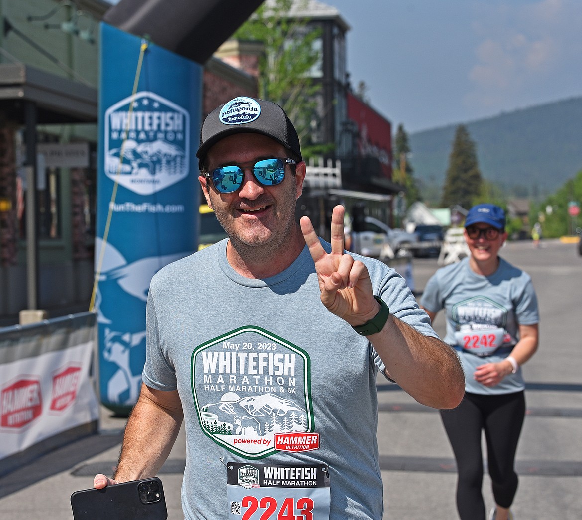 Shawn and Christina Isakson cross the finish line in good spirits at the Whitefish Marathon. (Julie Engler/Whitefish Pilot)